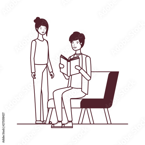 silhouette of couple sitting on chair with book in hands © grgroup