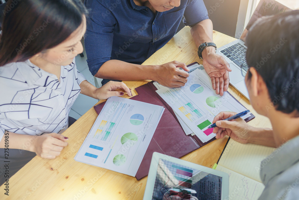 Business people meeting to discuss the situation on the market. Analyzing marketing data for start up new business project. Business people meeting to discuss the situation on the market. Analyzing marketing data for start up new business project.