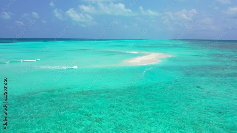 crystal clear water of indian ocean, waves gently splashing on one of the sandbars in Zanzibar Archipelago, aerial drone dolly in shot crystal clear water of indian ocean, waves gently splashing on one of the sandbars in Zanzibar Archipelago, aerial drone dolly in shot