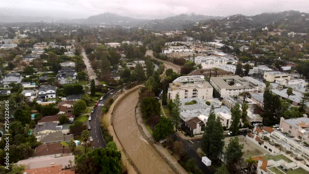 Above fast flowing rapid water in LA River drainage during storm surge. Above fast flowing rapid water in LA River drainage during storm surge.