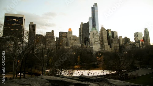 Ice skating in Central Park under the skycrapers of Manhattan.