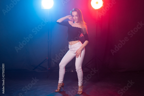 Young woman dancing in the dark, emotions and enjoyment © satura_
