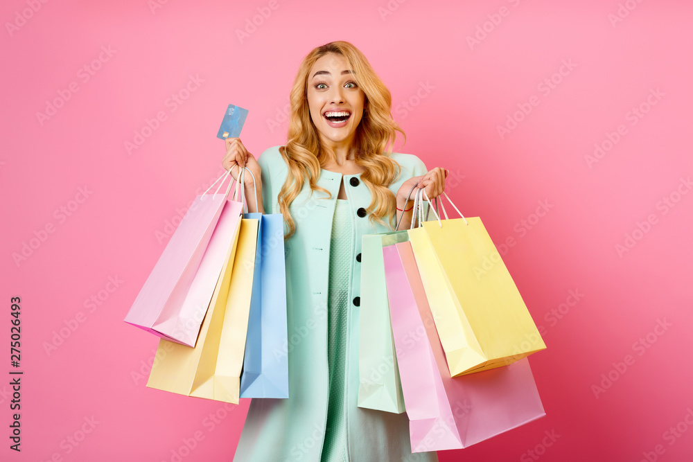 Excited Screaming Woman Holding Shopping Bags And Debit Card
