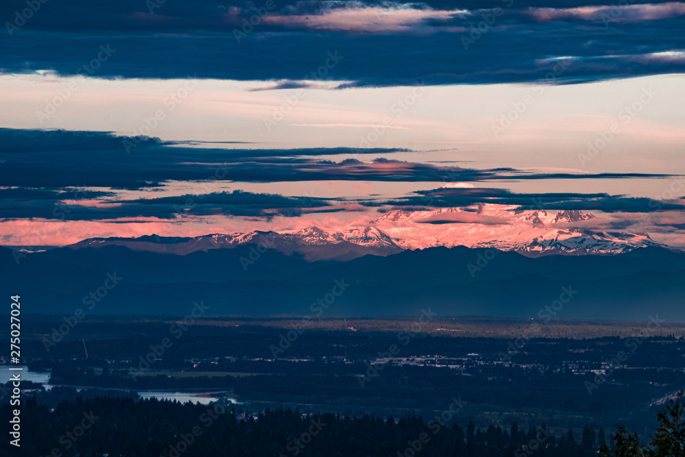 Sunset alpenglow over Mount Baker, Washington, USA seen from Canada