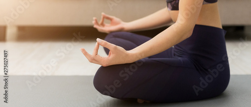 Keep Calm. Woman Meditating In Lotus Position At Home