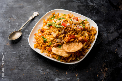 Bhelpuri Chaat/chat is a road side tasty food from India, served in a bowl or plate. selective focus