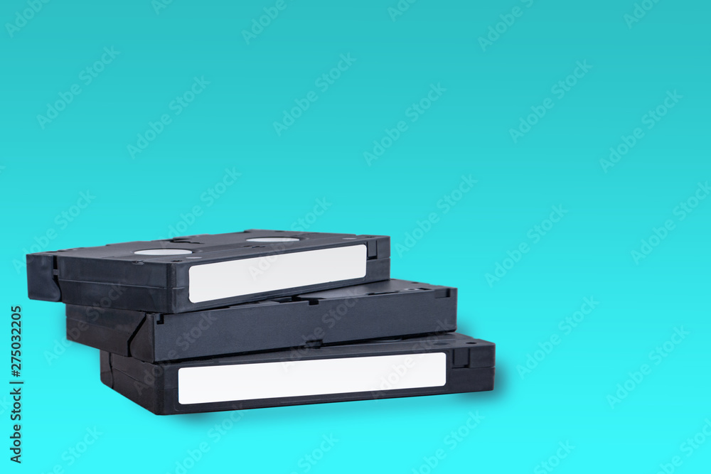VHS videotapes on a blue background folded vertically VHS videotapes on a blue background folded vertically