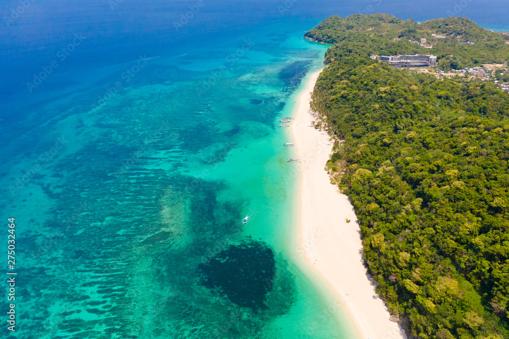 Puka Shell Beach. Seascape with island of Boracay, Philippines, top view. Beautiful coast with a white beach in sunny weather. Puka Shell Beach. Seascape with island of Boracay, Philippines, top view. Beautiful coast with a white beach in sunny weather.