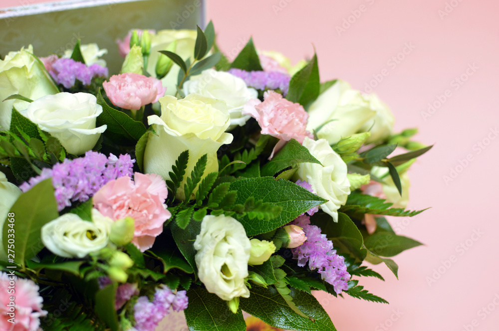 Spring bouquet of mixed flowers in a vintage box