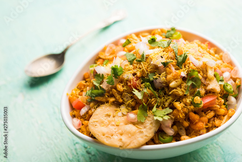 Bhelpuri Chaat/chat is a road side tasty food from India, served in a bowl or plate. selective focus