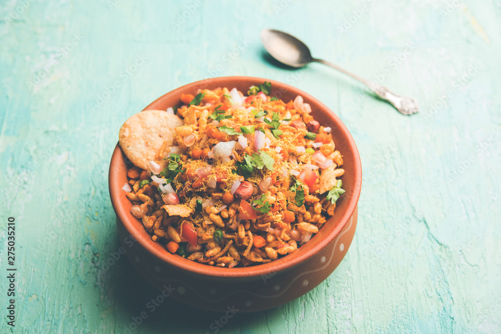 Bhelpuri Chaat/chat is a road side tasty food from India, served in a bowl or plate. selective focus