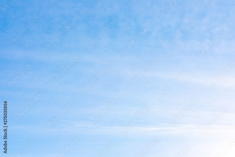 Beautiful, abstract, blue sky background. There are feathery clouds in the sky. A good place to place the text.