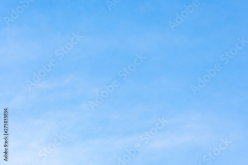 Beautiful, abstract, blue sky background. There are feathery clouds in the sky. A good place to place the text.