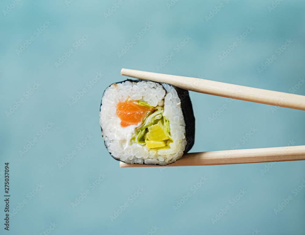 single sushi in the chopsticks single sushi in the chopsticks
