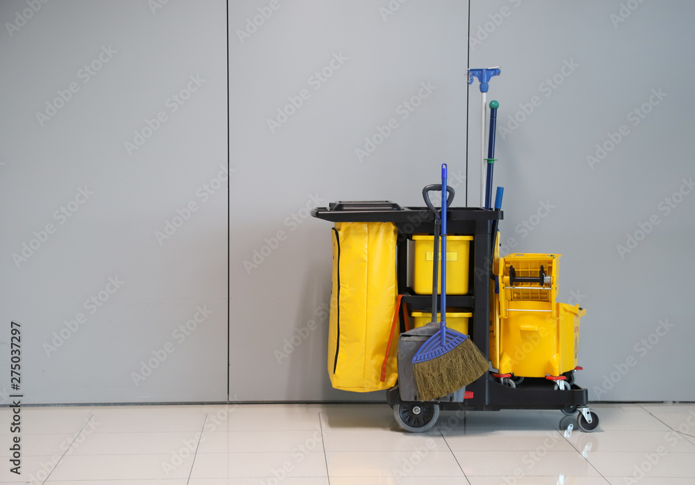 Closeup of janitorial, cleaning equipment and tools for floor cleaning with wall background. Closeup of janitorial, cleaning equipment and tools for floor cleaning with wall background.