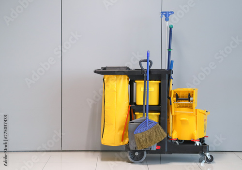 Closeup of janitorial, cleaning equipment and tools for floor cleaning with wall background at the airport. 