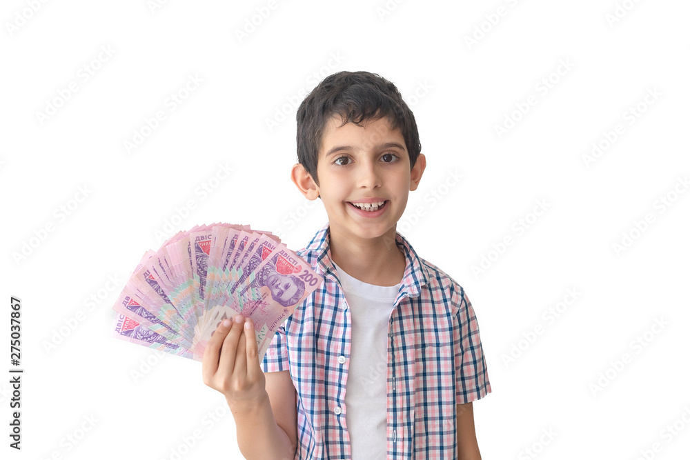 Portrait of a cheerful teenager holding ukrainian hryvnias over white background. Portrait of a cheerful teenager holding ukrainian hryvnias over white background.