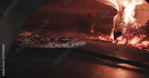 Pizza with leopard spots open flame brick oven. Authentic Neapolitan Pizza cooked in a wood fire oven.