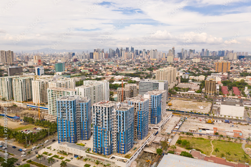 The city of Manila, the capital of the Philippines. Modern metropolis in the morning, top view. New buildings in the city. Panorama of Manila. Skyscrapers and business centers in a big city.