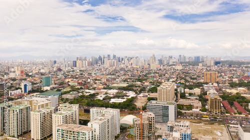 The city of Manila  the capital of the Philippines. Modern metropolis in the morning  top view. New buildings in the city. Panorama of Manila. Skyscrapers and business centers in a big city.