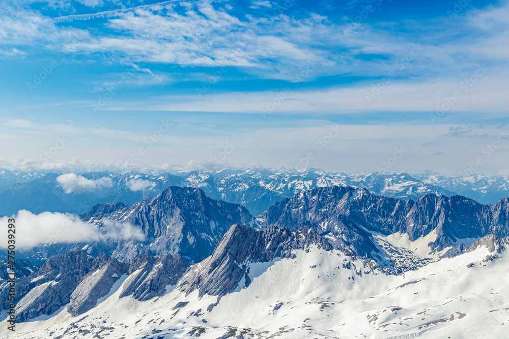 Panoramic view of the European Alps from the top of Zugspitze on a sunny summer day Panoramic view of the European Alps from the top of Zugspitze on a sunny summer day