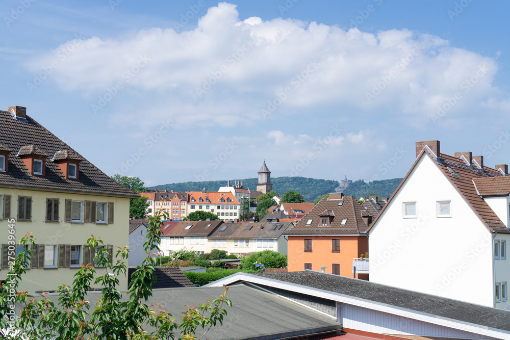 View over the roofs of Kirchditmold, a district of Kassel in Germany, to the famous landmark of Hercules