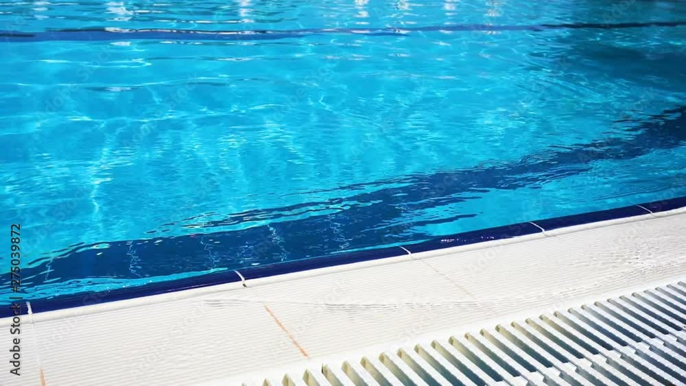 Blue surface water in the pool. Edge the pool. Blue surface water in the pool. Edge the pool.