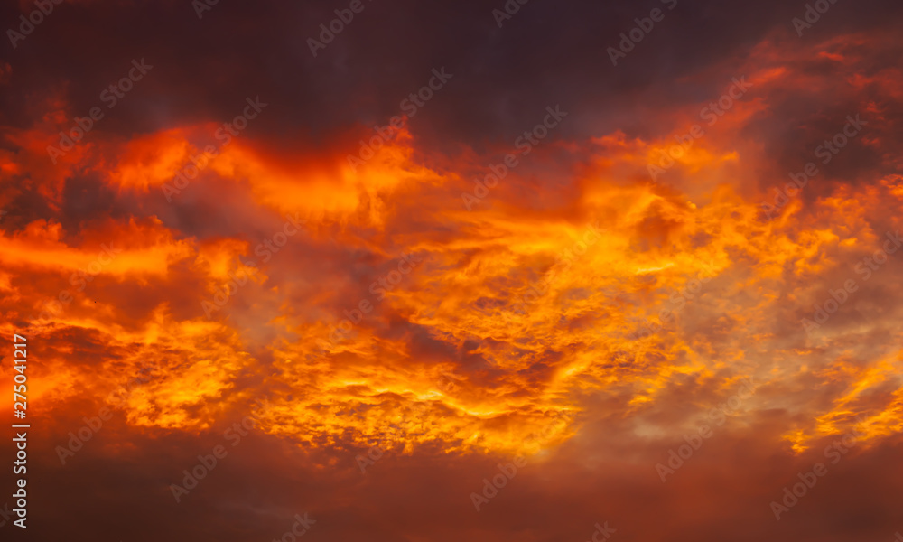 Beautiful fiery, orange and red, sunset sky. Evening Magic Scene. Composition of nature