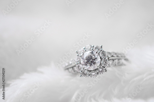 luxury jewelry diamond ring on white fur texture