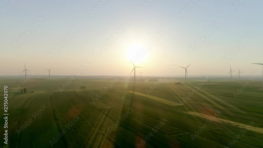 Drone view of wind turbines in sunny day Drone view of wind turbines in sunny day