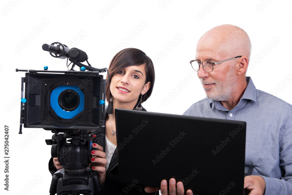 cameraman and a young woman with a movie camera SLR on white