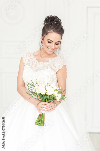 Beautiful Bride Portrait wedding makeup and hairstyle, marriage flowers bouquet, fashion bride gorgeous beauty, smiling happy bride portrait