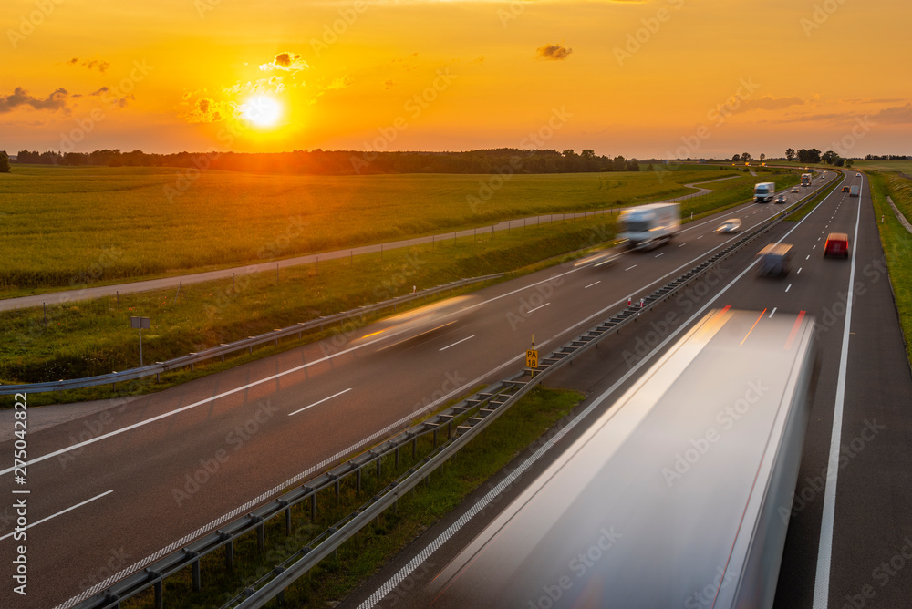 intensive highway traffic at sunset