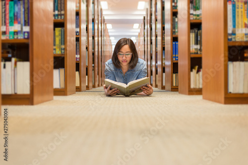Young Woman Asking for Silence in the Library Room