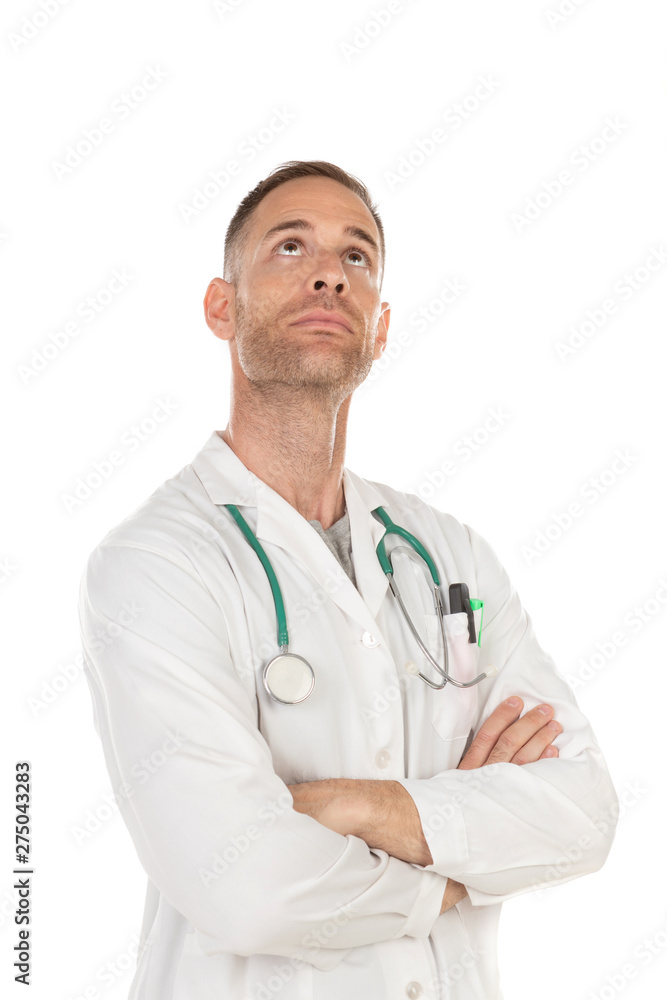 Pensive young doctor wearing a white gown Pensive young doctor wearing a white gown