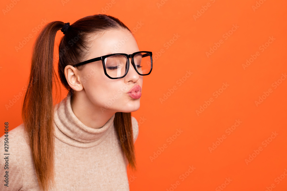 Profile side view photo attractive millennial funny love send kisses boys date valentine close eyes day peaceful calm cute pretty stylish trendy dream charming turtleneck isolated orange background