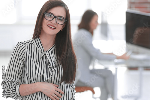successful business woman on the background of her office