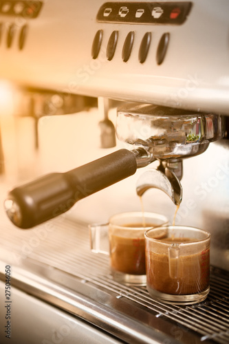 Coffee Machine pouring coffee to a cup.