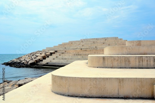 Sphinx of Durres (Sfinksi) called also Urban Cape at Durres town, Albania. Seaside large steps, stairs at the embankment, popular tourist place, viewpoint photo