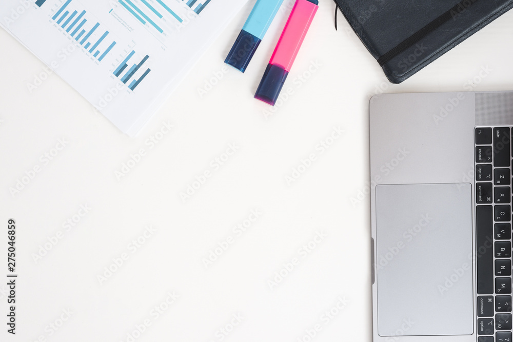 Office desktop with laptop and analytics Office desktop with laptop and analytics