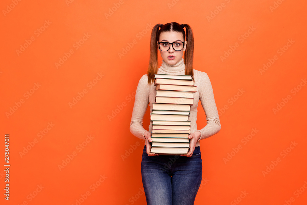 Close up photo beautiful amazing she her lady pretty hairstyle open mouth hold arms hands many books eyes full fear examination wear casual pastel pullover outfit clothes isolated orange background Close up photo beautiful amazing she her lady pretty hairstyle open mouth hold arms hands many books eyes full fear examination wear casual pastel pullover outfit clothes isolated orange background