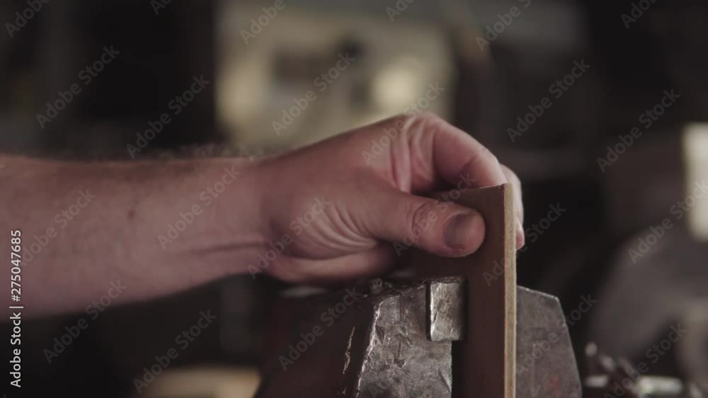 Young man is craft working at a work bench, woodworking, home woodwork Young man is craft working at a work bench, woodworking, home woodwork