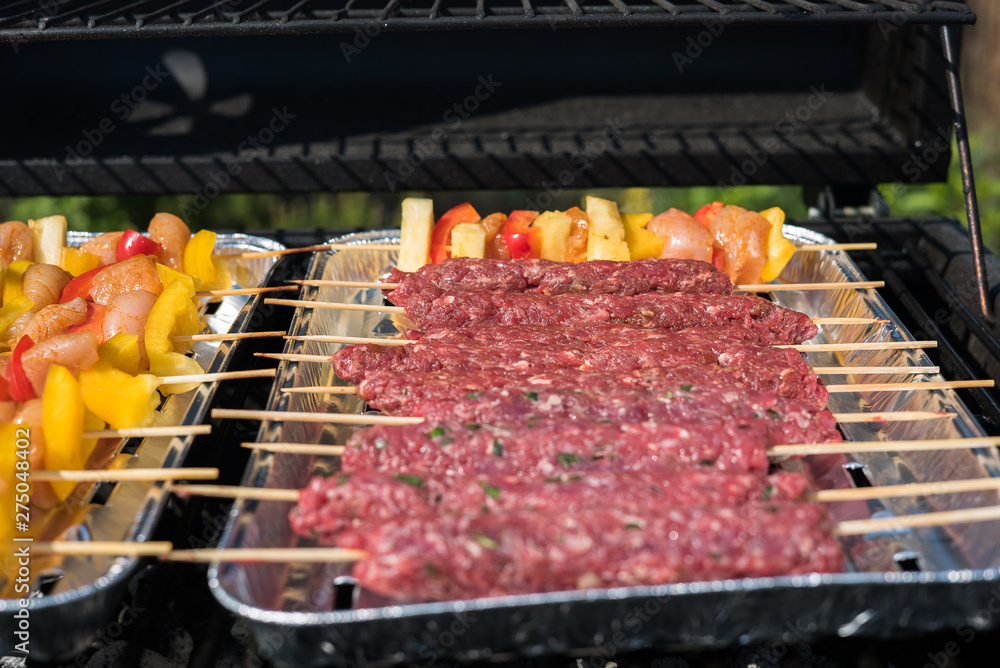  grilling meat and vegetables outdoor