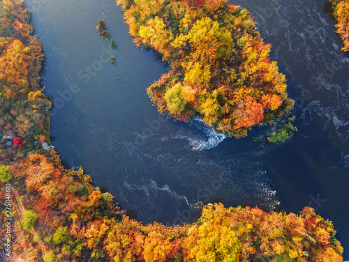 colorful forest, blue river and rocks. natural beautiful autumn landscape (background). drone shot, bird's-eye, aerial view © ver0nicka