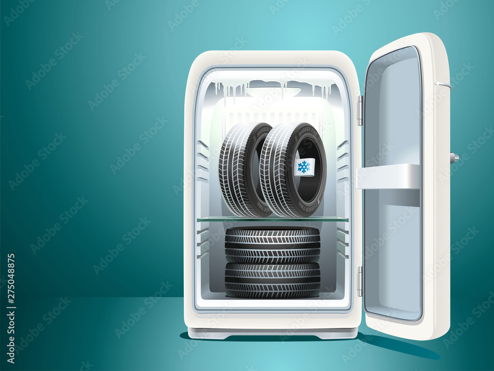 Winter tires with a label are stored in a vintage refrigerator with the door open Winter tires with a label are stored in a vintage refrigerator with the door open