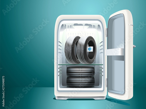  Winter tires with a label are stored in a vintage refrigerator with the door open