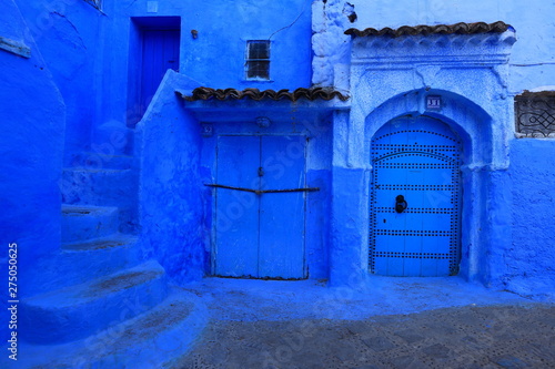 Blue street walls of the popular city of Morocco, Chefchaouen. Traditional moroccan architectural details.  © AnastasiiaUsoltceva