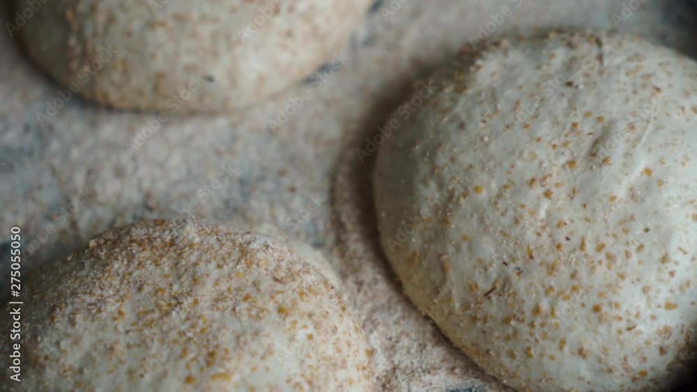 Slow Mo Pan of sourdough bread dough resting before ready to be formed into home made pizza's. Slow Mo Pan of sourdough bread dough resting before ready to be formed into home made pizza's.