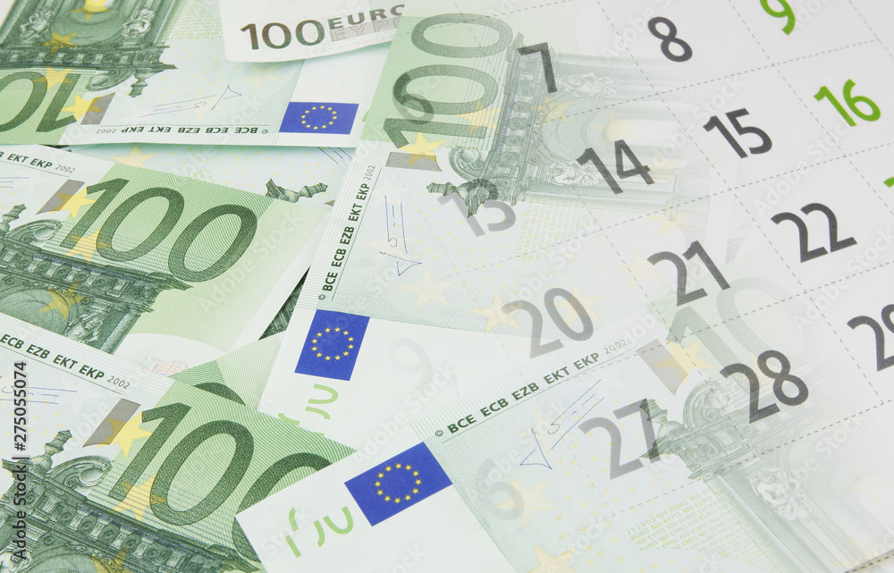 Planning and investing concept, euro banknotes and calendar Planning and investing concept, euro banknotes and calendar