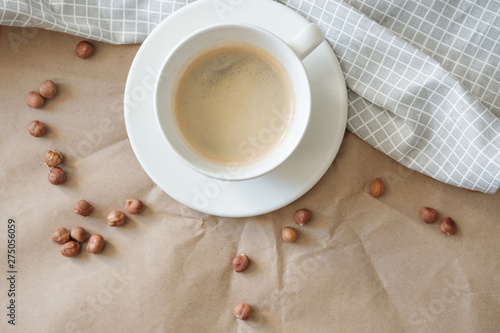 hot nutty morning coffee on a gray napkin and craft paper